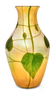 Tiffany Studios Intaglio Carved Favrile Glass "Leaf & Vine" Vase: Tiffany Studios"Leaf & Vine" Vasecirca 1914intaglio carved favrile glassengraved "L.C. Tiffany - Favrile, 7950H"12 1/4 x 6 3/4 inchesProvenance: Property from an Important West Coast Collection