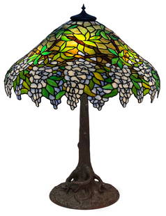 Unique Art Glass & Metal Co. "Wisteria" Table Lamp: Unique Art Glass & Metal Co."Wisteria" Table Lampearly 20th centuryleaded glass, patinated metal31 in. high, 24 in. diameter (shade)Other Notes: Fontaine's Auction Gallery can arrange shipping for thi
