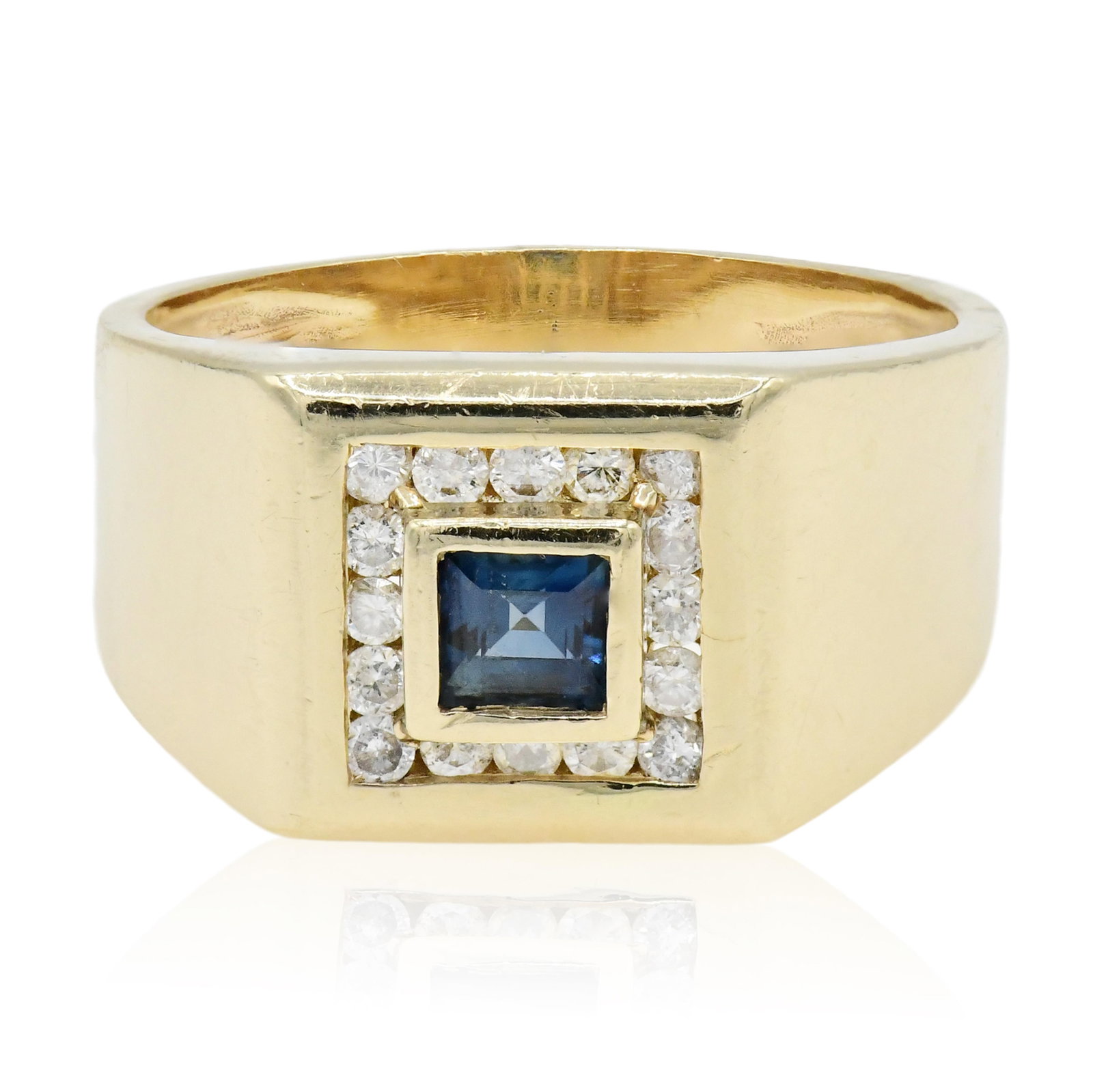 14K Yellow Gold Sapphire and Diamond Ring: 14K Yellow Gold Sapphire and Diamond Ring • set with a 0.42 carat faceted square blue sapphire • accented by round brilliant diamonds weighing a total of 0.32 carats • 8 3/4 (ring
