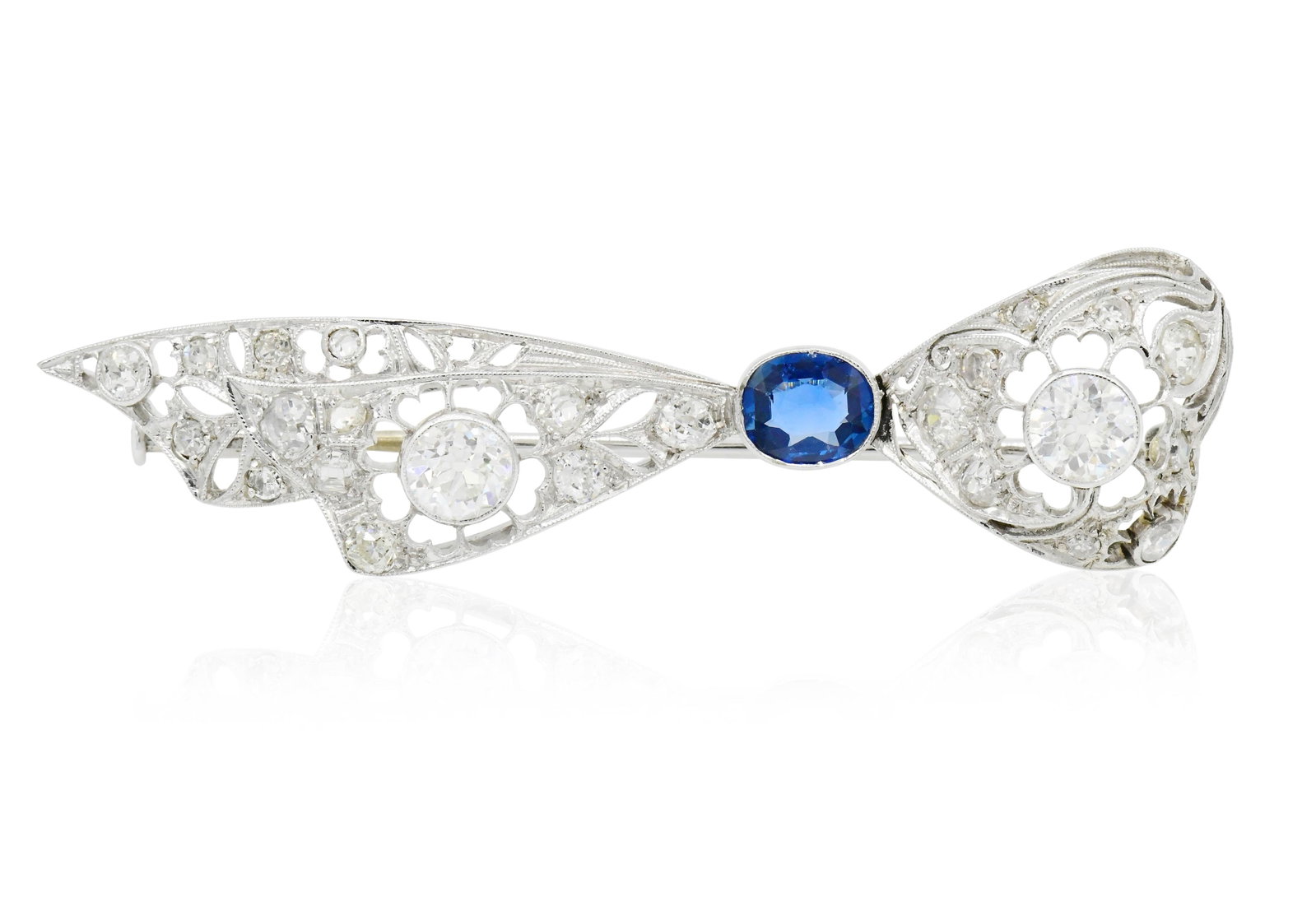 10K White Gold, Diamond & Sapphire Brooch: 10K White Gold, Diamond & Sapphire Brooch • set with Old European cut diamonds, single cut diamonds and one princess cut diamond weighing a total of 2.53 carats • centering a 0.86 carat 