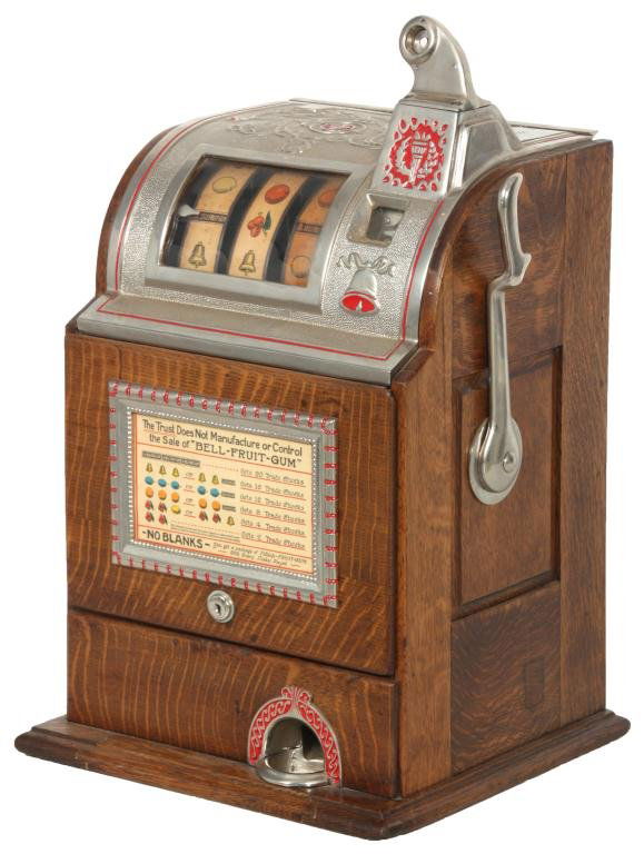 Jennings 5 Cent Operators Bell Slot Machine: Jennings 5 Cent Operators Bell Slot Machine. Cast arched top, paint decorated trim and borders with quartersawn oak frame. Back & key are present and is in good working condition; with Jennings logo o