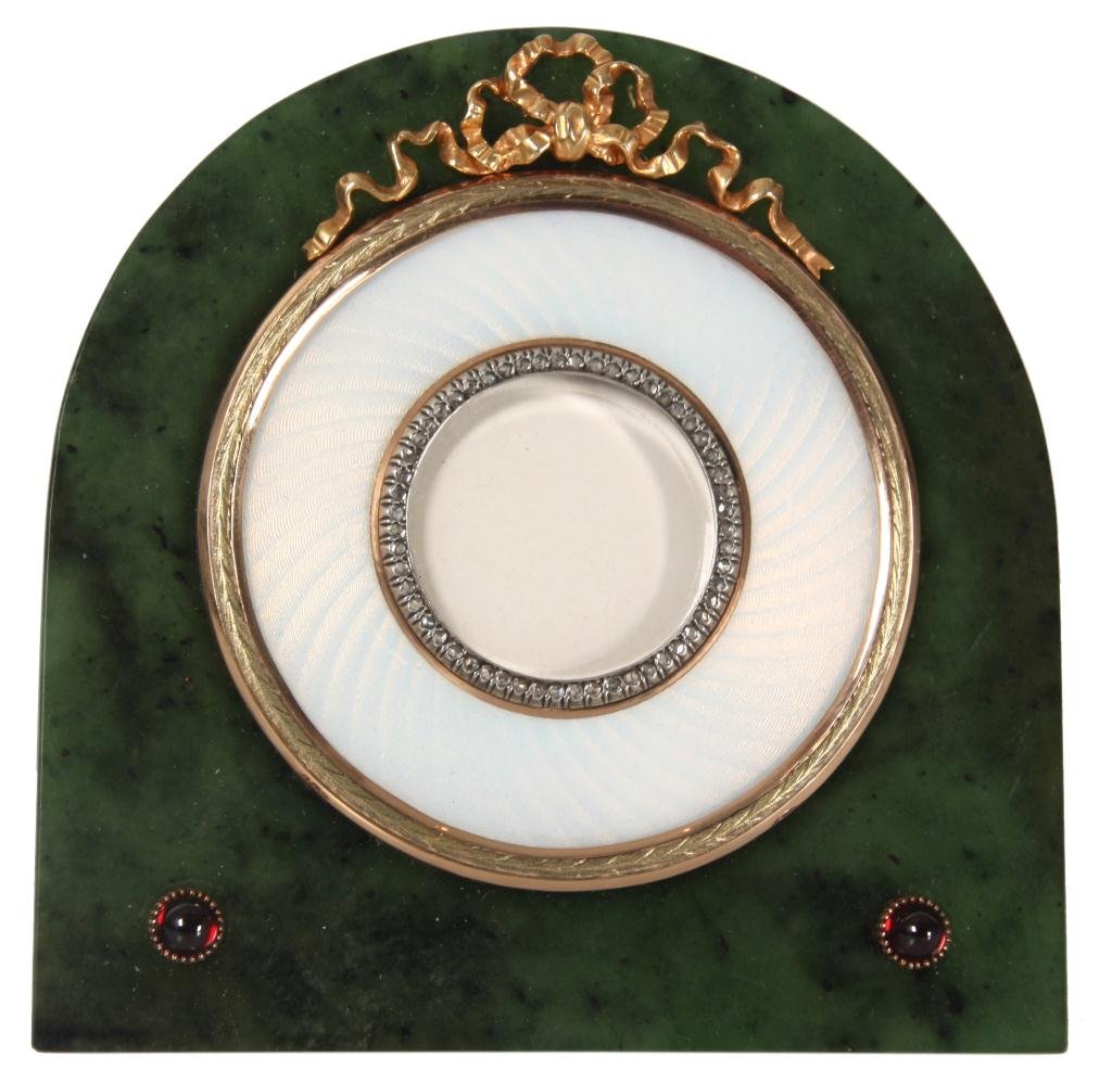 Faberge Enamel, Jade & Gold Frame: Russian Enamel, Jade & Gold Frame. Small desk frame with an arched top, has a spinach green jade border and 14k yellow gold bezel and ribbons around a white guilloche enamel border and inner bezel wit