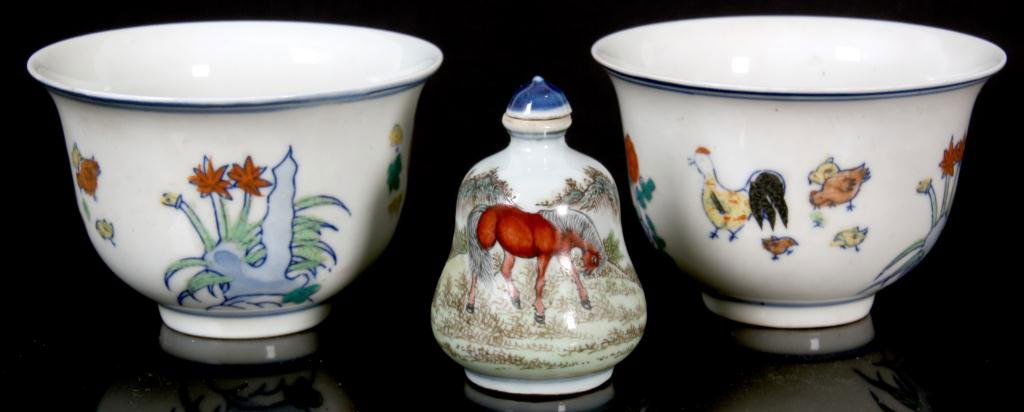 2 Porcelain Cups & 1 Snuff Bottle: 2 Porcelain Cups & 1 Snuff Bottle. The cups are painted on the front and back with chickens and flowers on a white background, with Ming dynasty marks on the bottom. The porcelain snuff bottle depicts