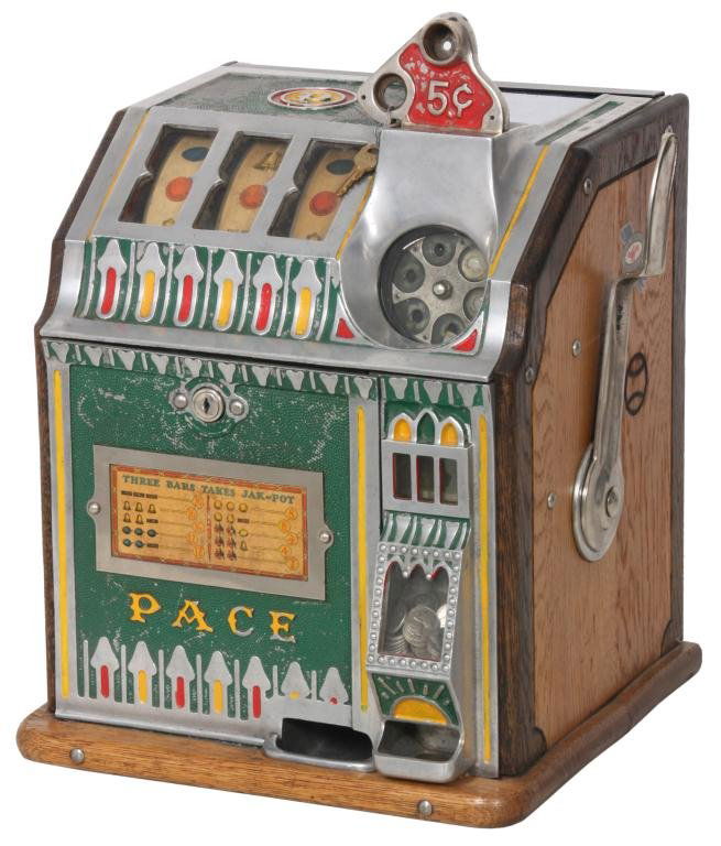 5 Cent Pace Slot Machine: Pace 5 Cent Slot Machine. Cast front and top, paint decorated trim and borders with oak sides. Has back & key and is in good working condition; signed with Branded mark on the sides and Pace Mfg. Co.