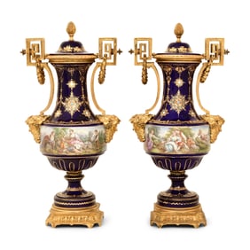 Pair of Sèvres-Style Gilt Bronze-Mounted Porcelain Urns and Covers