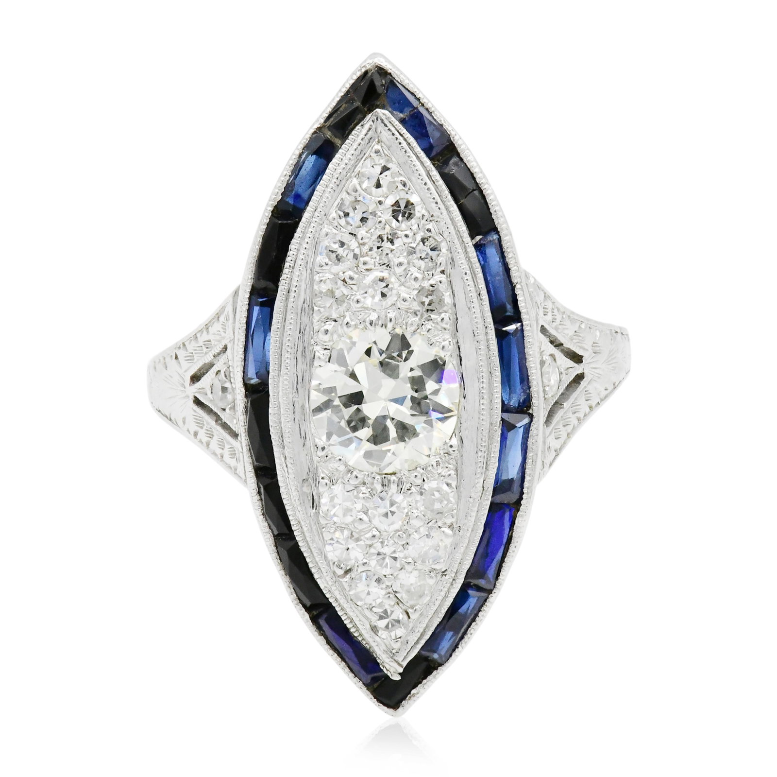 Platinum, Diamond & Sapphire Ring: Platinum, Diamond & Sapphire Ring • centering a 0.66 carat round brilliant diamond with color, clarity, cut and fluorescence • accented by faceted rectangular blue sapphires weighing a tot