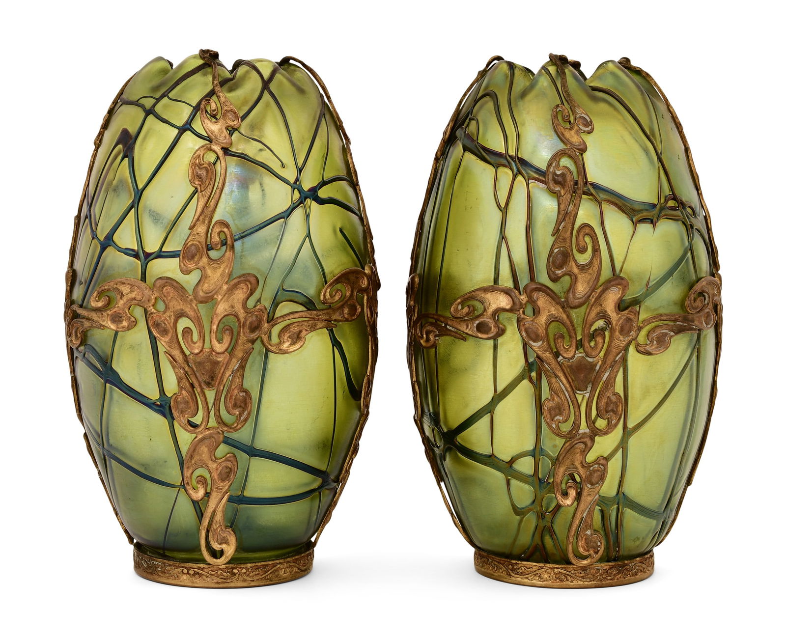 Loetz, Pair of Gilt Bronze-Mounted Threaded Vases: LoetzPair of Threaded Vasescirca 1900iridescent glass, gilt bronzeeach signed to the underside "Loetz, Austria"9 x 5 1/2 inchesProvenance: Private Collection, Orchard Park, New York