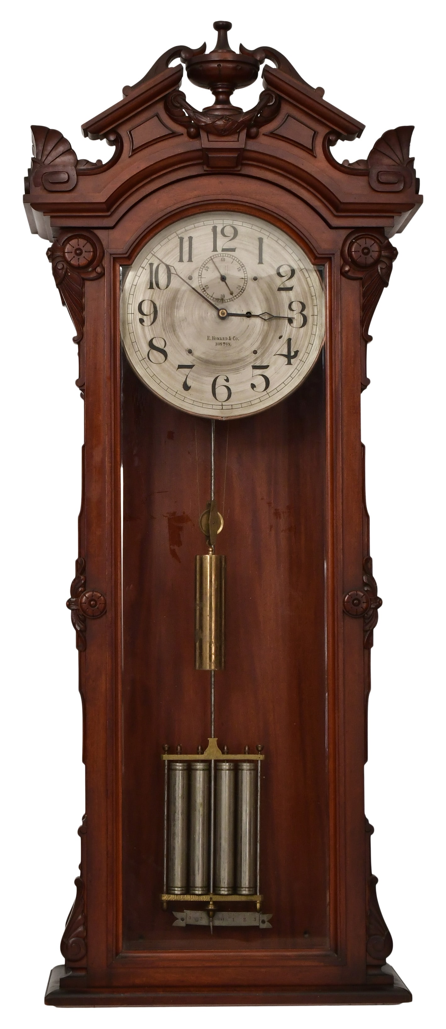 E. Howard & Co. "No. 60 Regulator" Wall Clock: E. Howard & Co. "No. 60 Regulator" Wall Clockcirca 1880the walnut case with a carved pediment crest and silvered dial, brass 8-day time-only weight-driven regulator movement with deadbeat escapement,