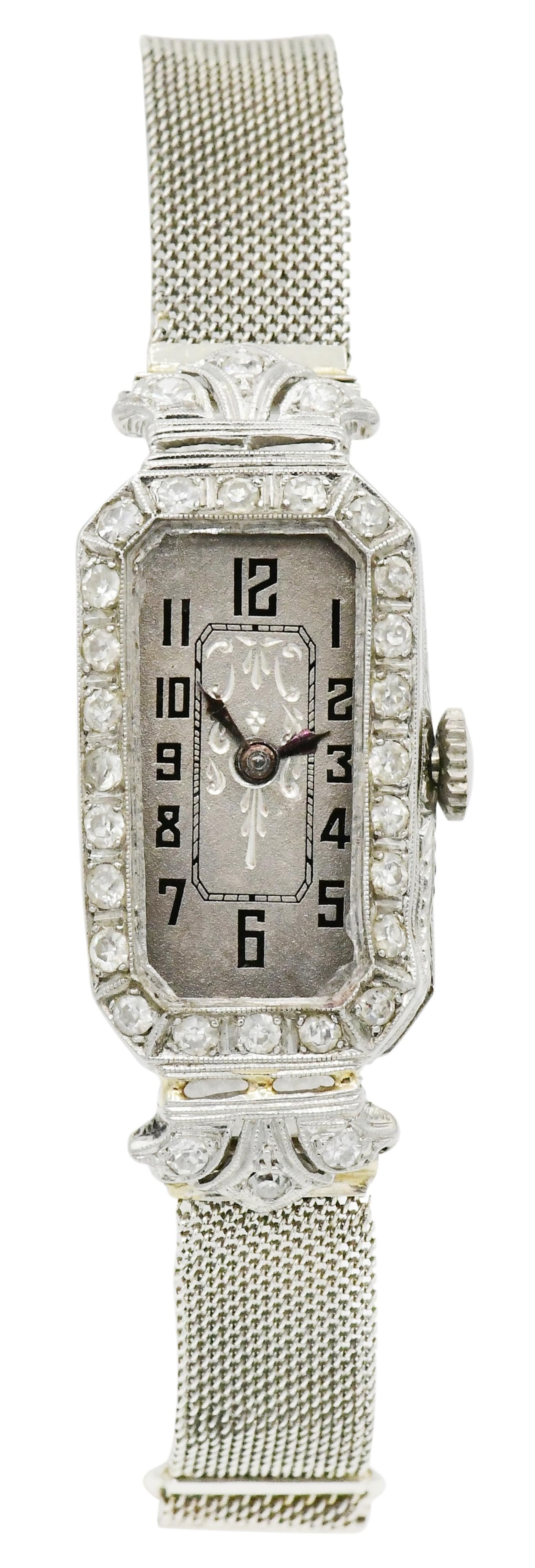 Platinum & Diamond Art Deco Wristwatch: Platinum & Diamond Art Deco Wristwatch Case Material: platinum Case Dimensions: 38 x 16 mm Dial: silvered, plume hands Movement: quartz Band: 14K white gold, adjustable Total Weight: 18.6 grams Proven
