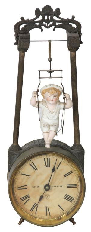 Ansonia Swing No.1 Bobbing Doll Clock: Ansonia Swing No.1 Bobbing Doll Clock. 3 in. bisque figure of a child seated on a swing acts as the pendulum bob for this clock, numbered 2844 on the bottom; the swing hangs from a frame at the top of