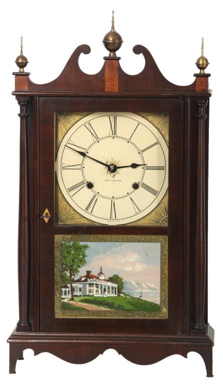 Seth Thomas Cambridge Pillar & Scroll Clock: Seth Thomas Cambridge Pillar & Scroll Clock. Painted metal dial has a 7.5 in. chapter ring with black Roman hour numerals and gilt corner pieces, black spade hands, dial signed Seth Thomas; 8 day bras