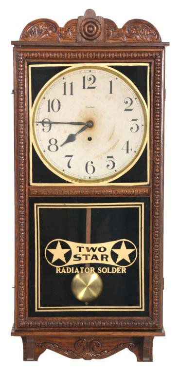 Waterbury Crane Advertising Wall Regulator: Waterbury Crane Advertising Wall Regulator. 12 in. paper dial has black Arabic hour numbers, large spade hour hand and pointer minute hand, brass bezel; 8 day time only spring driven movement No. 20 s