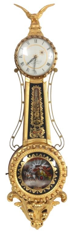 Elmer O. Stennes Girandole Banjo Clock: Elmer O. Stennes Girandole Banjo Clock. The clock has typical fancy pierced hands, signed metal painted 6.5 in. dial with black Roman hour numerals, black chapter ring with black minute markers, typic