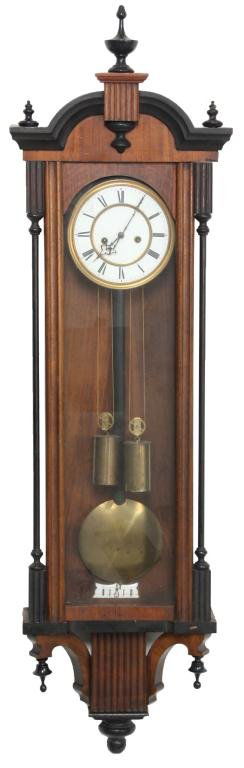 2 Weight Vienna Regulator: 2 Weight Vienna Regulator. 7 in. porcelain dial has black Roman hour numerals, brass bezel and fancy pierced hands, (chapter ring has cracks); brass weight driven movement with half hour strike on a c