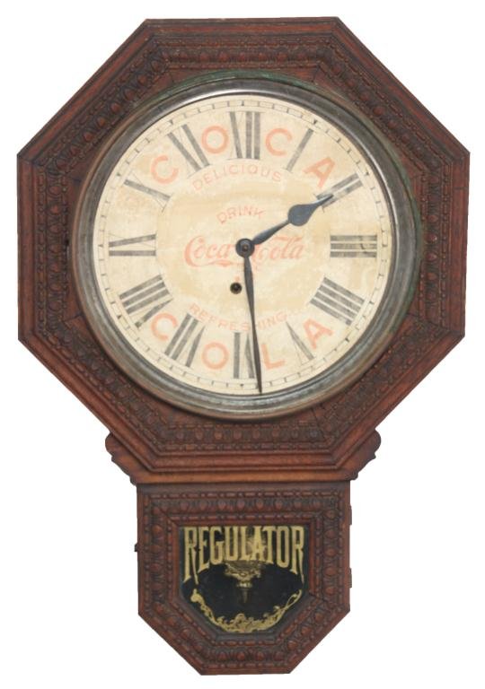 Ingraham Short Drop Coca-Cola Advertising Clock: Ingraham Short Drop Coca-Cola Advertising Clock. 11 in. paper dial has black Roman hour numerals, red advertising lettering for "Drink Coca-Cola, 5 Cents, Delicious, Refreshing", has large black spade