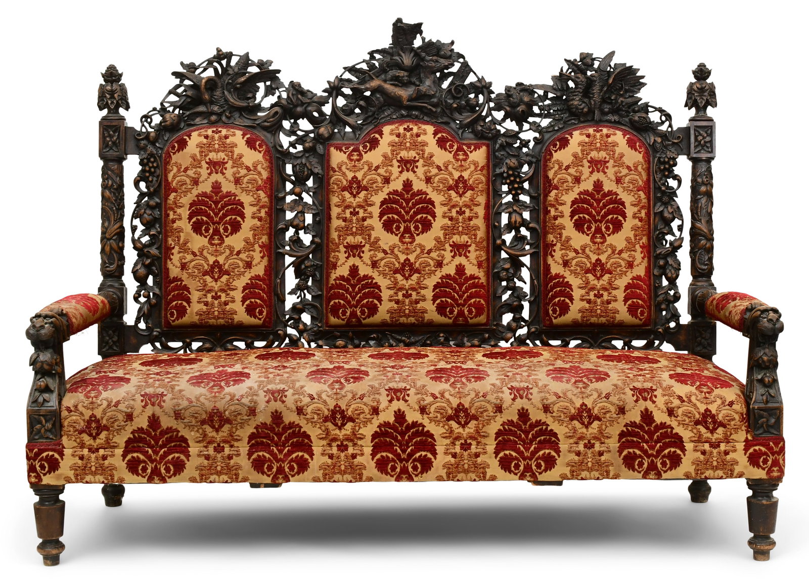 A Fine Italian Carved Walnut Sofa: A Fine Italian Carved Walnut Sofalate 19th centurythe sofa elaborately carved with a deer, monkey, squirrel, swan, fish, dogs, birds, fruit, berry clusters, foliate and mythical-faced arms58 x 77 x 32
