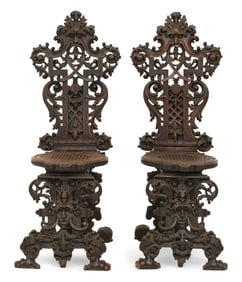 A Pair of Continental Carved Walnut "Fantasy" Chairs