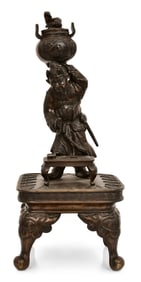 Japanese Patinated Bronze Sculpture of a Man Holding an Urn