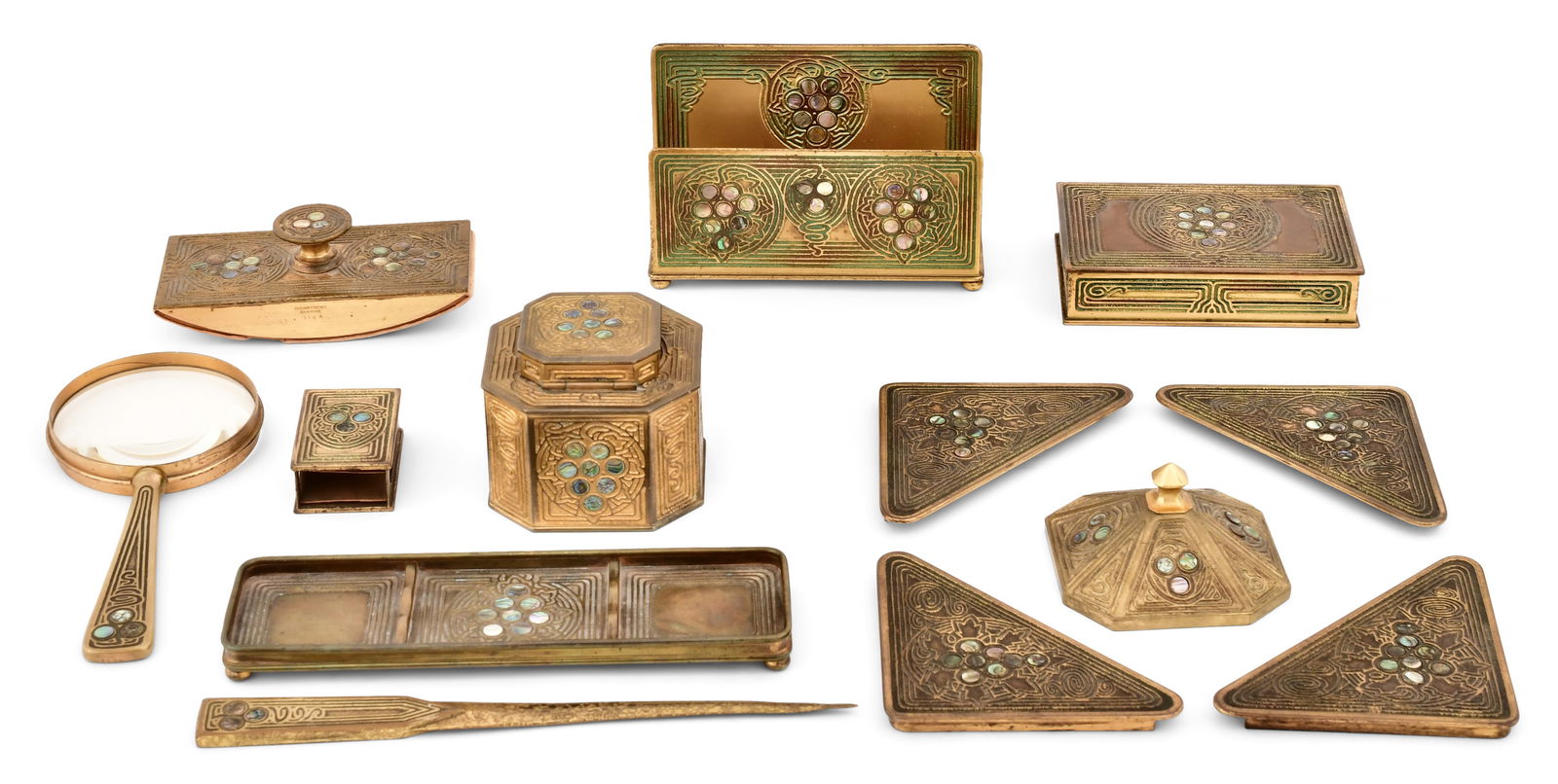 Tiffany Studios Ten-Piece "Abalone" Desk Set: Tiffany StudiosTen-Piece "Abalone" Desk Setcirca 1915gilt bronze, abalone inlaycomprising a rocker blotter, letter rack, box, magnifying glass, match box, inkwell, pen tray, letter opener, paperweight