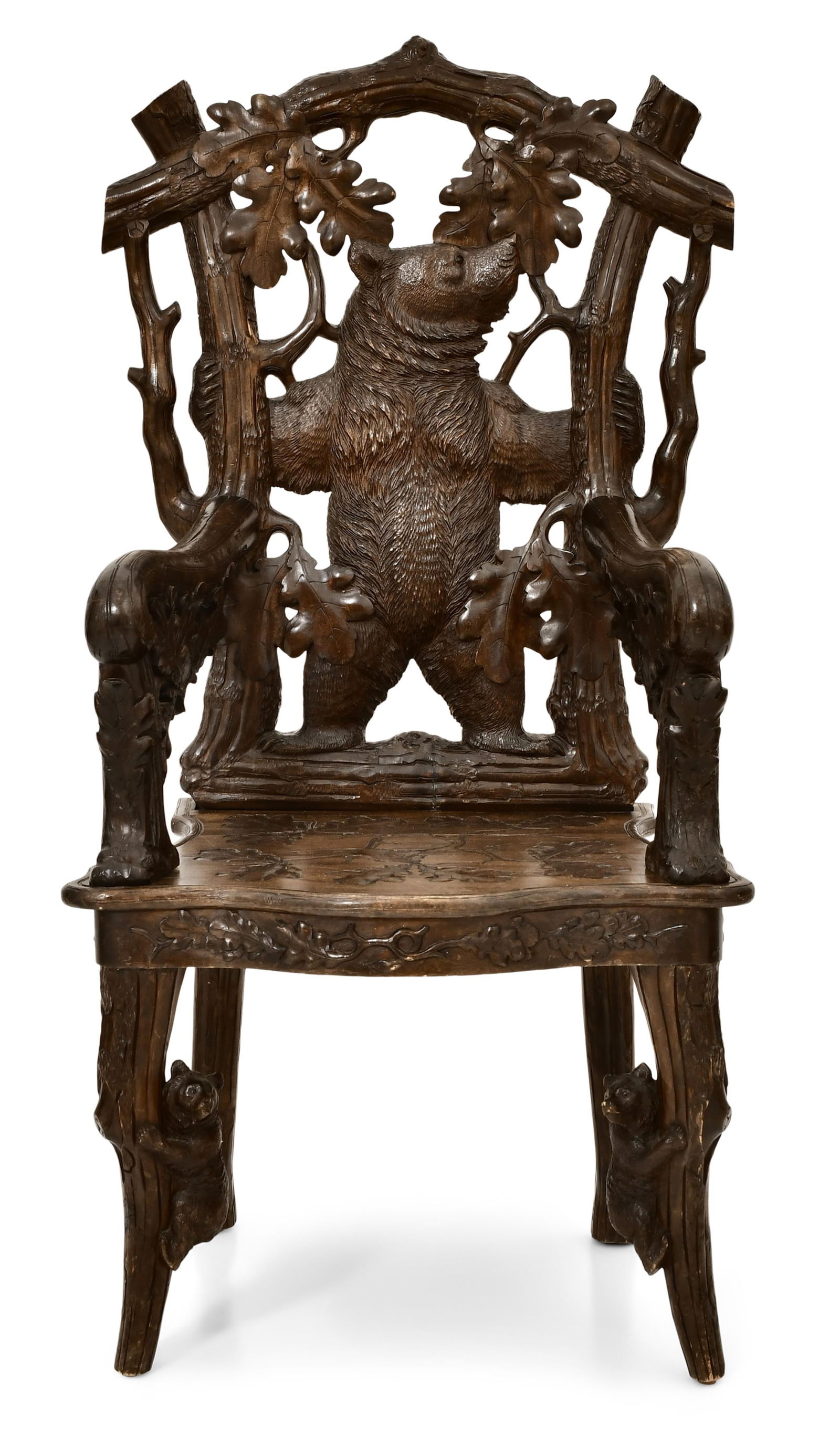 Black Forest Carved Wood Bear Chair: Black Forest Carved Wood Bear Chair late 19th century the chair with a full-figured bear, oak leaves, branches and two bears on the front legs 51 x 26 x 21 inches Provenance: Private Collection,