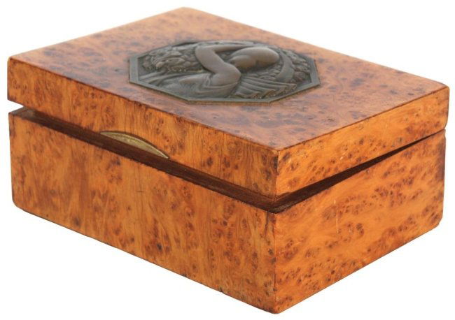 P. Turin Bronze & Birds Eye Dresser Box: Pierre Turin Bronze & Birds Eye Maple Dresser Box. The beautiful birds eye maple box has a hinged lid and measures 2.5 in. high x 5.5 in. wide x 4 in. deep. The octagonal bronze medallion mounted in t