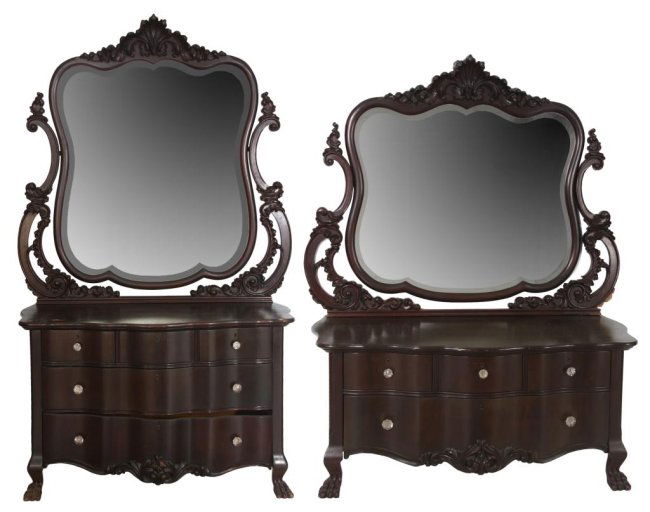 2 Carved Mahogany Serpentine Dressers: 2 Carved Mahogany Serpentine Dressers. Both have swiveling beveled mirror backs with filigree carved crests and support arms, serpentine front design on the bases with claw feet, dresser has 3 drawers