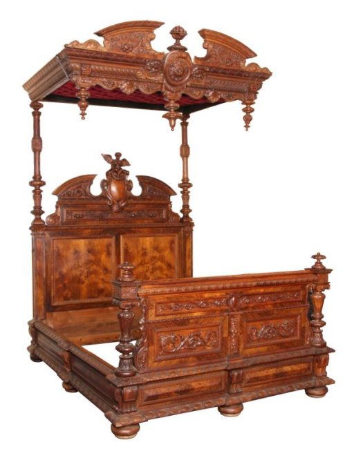 Rosewood Carved Cherub 1/2 Tester Bed: Rosewood Carved Cherub 1/2 Tester Bed. Massive headboard with double burled panels, high broken arch crest, centered with a winged cherub seated on a medallion, has fancy swirling filigree and corbels