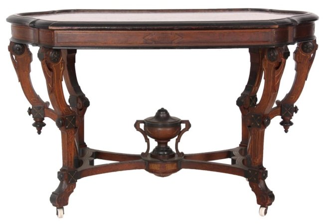 Renaissance Revival Inset Marble Top Table: Renaissance Revival Inset Marble Top Table. Brown inset marble top with ebonized border, the apron has burled walnut panels with gilt incised borders. Carved legs with gilt incising, rosettes, stylize