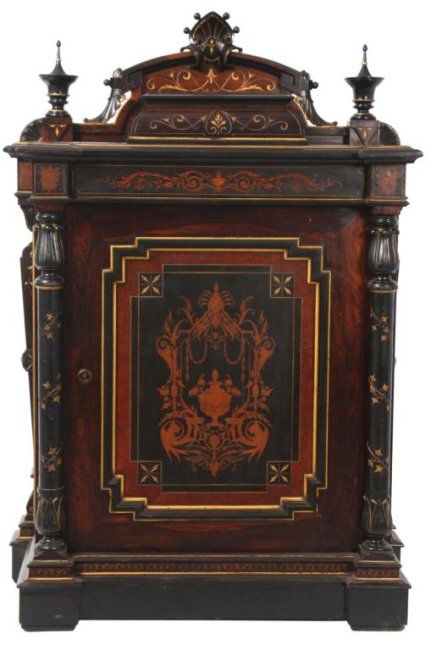 Inlaid Renaissance Revival Credenza: Inlaid Renaissance Revival Credenza. One door rosewood cabinet with shell carvings on the crest, turned finials and columns with ebonized trim, gilt incised embellishments and fancy satinwood inlays.