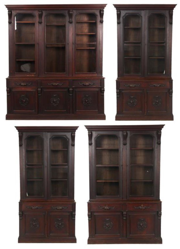 4 Carved Walnut Library Cabinets: 4 Carved Walnut Library Cabinets. An unusual matching set from a Victorian library. Matching cabinets have overhanging cornice tops over scrolling corbels, hand carved filigree pulls and fruit and shi