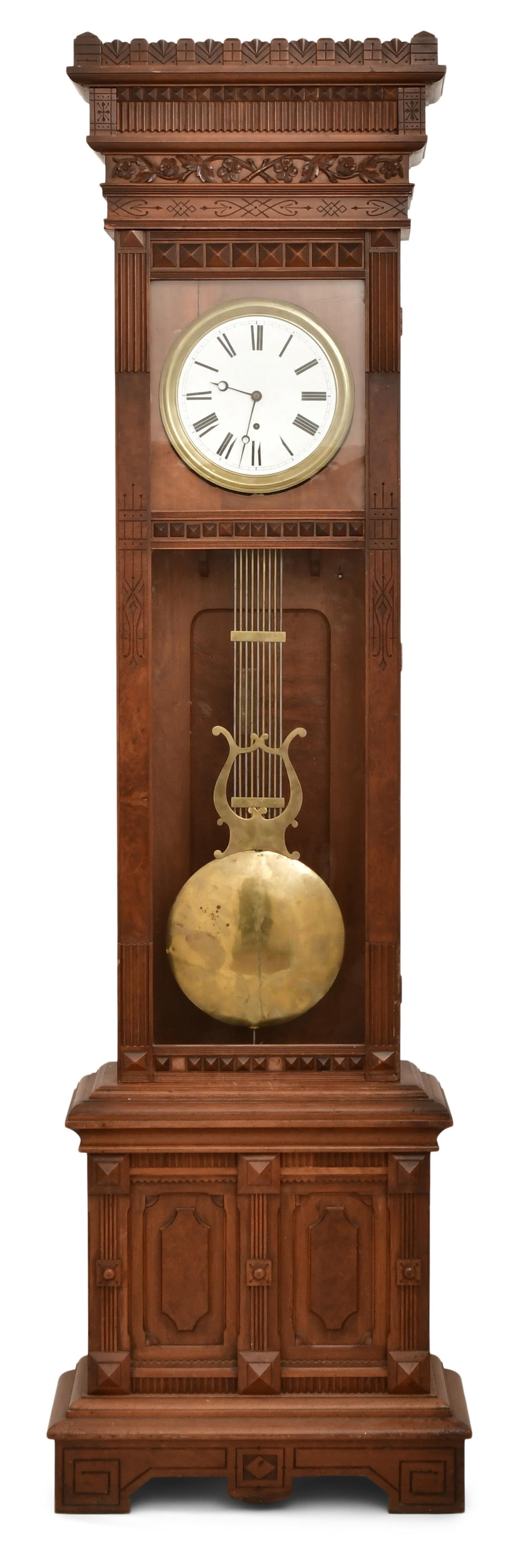 William L. Gilbert Clock Co. "Regulator No. 12" Wall Clock: William L. Gilbert Clock Co. "Regulator No. 12" Wall Clockearly 20th centurycarved walnut case with a large crest and paneled base, 11-inch porcelain dial with black Roman hour numerals, open moon han