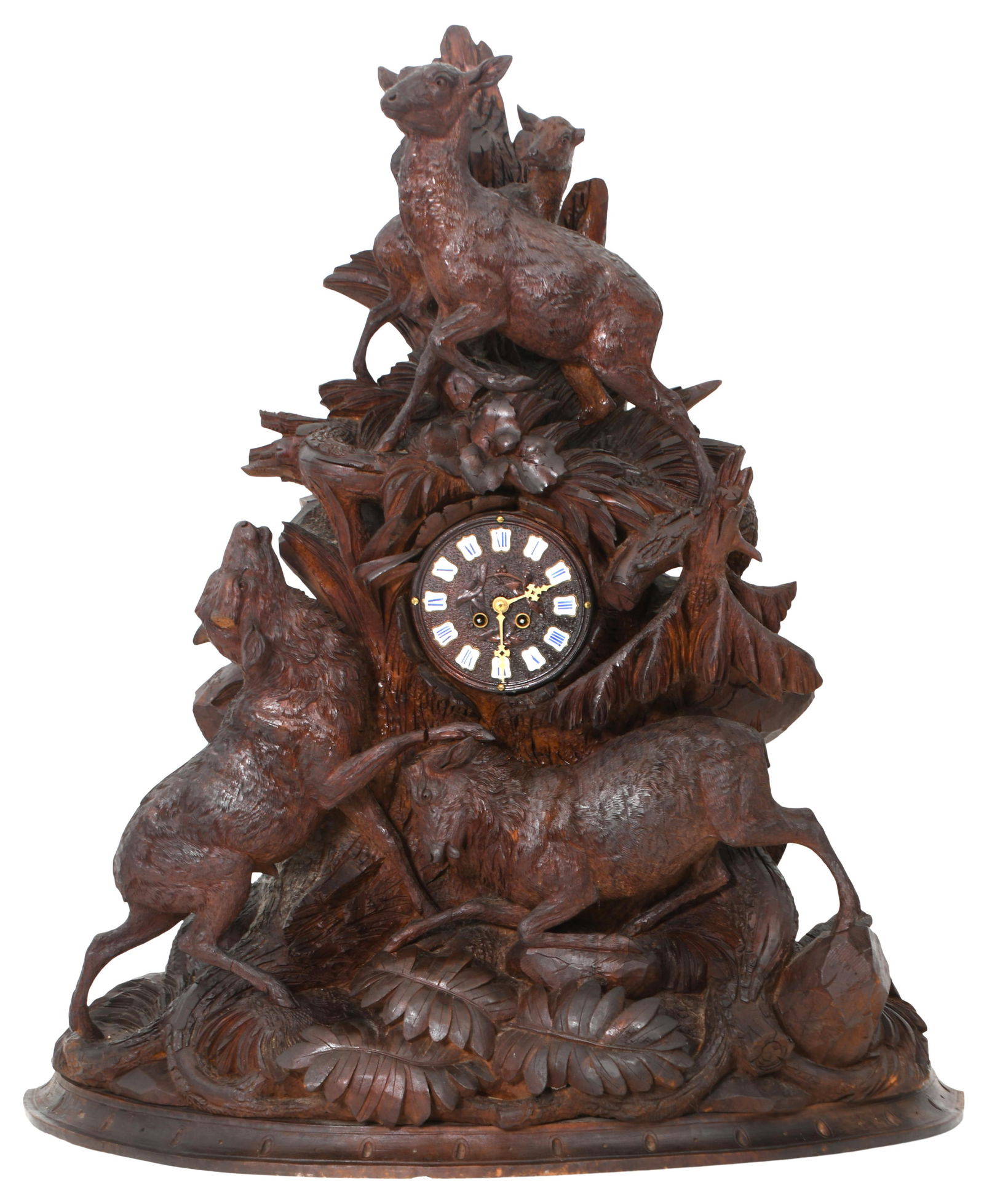 A Massive Black Forest Carved Figural Mantel Clock: A Massive Black Forest Carved Figural Mantel Clocklate 19th centurythe case carved with stags, leaves and branches, 8-day brass time and strike movement, dial with cartouche numerals, movement signed