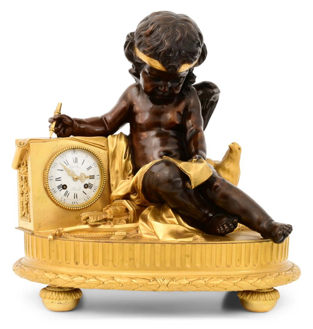 French Empire-Style Gilt & Patinated Bronze Mantel Clock with Cupid: French Empire-Style Gilt & Patinated Bronze Mantel Clock with Cupidlate 19th centurythe seated cupid writing on a scroll with a dove by his side, dial marked "Grobe, A Paris," brass eight-day spring-d
