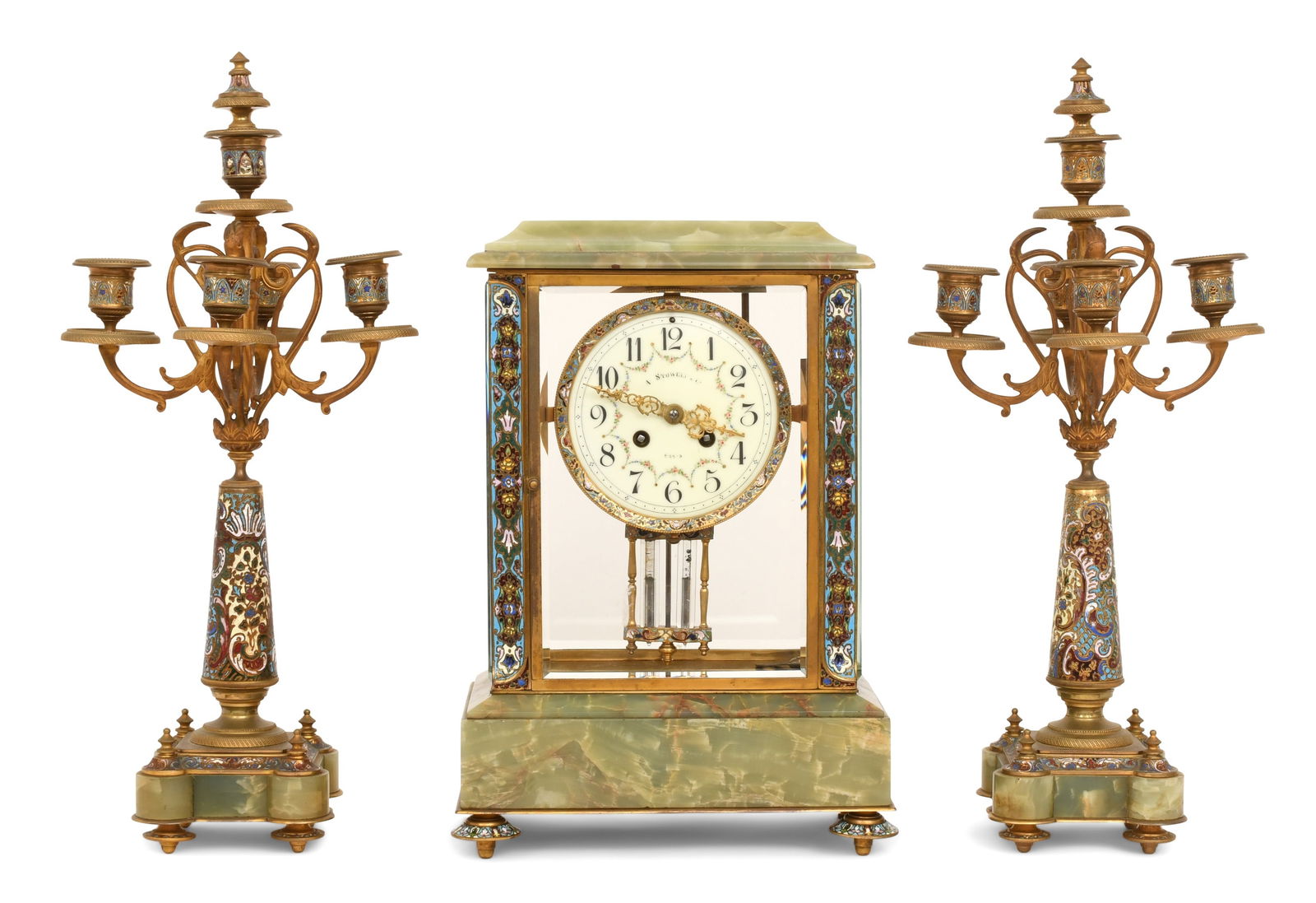 French Gilt Brass, Onyx & Champleve Clock Garniture: French Gilt Brass, Onyx & Champleve Clock Garnitureearly 20th centurythe clock together with two matching four-arm candelabra, French ebache 8-day brass time and strike movement with mercurial pendulu