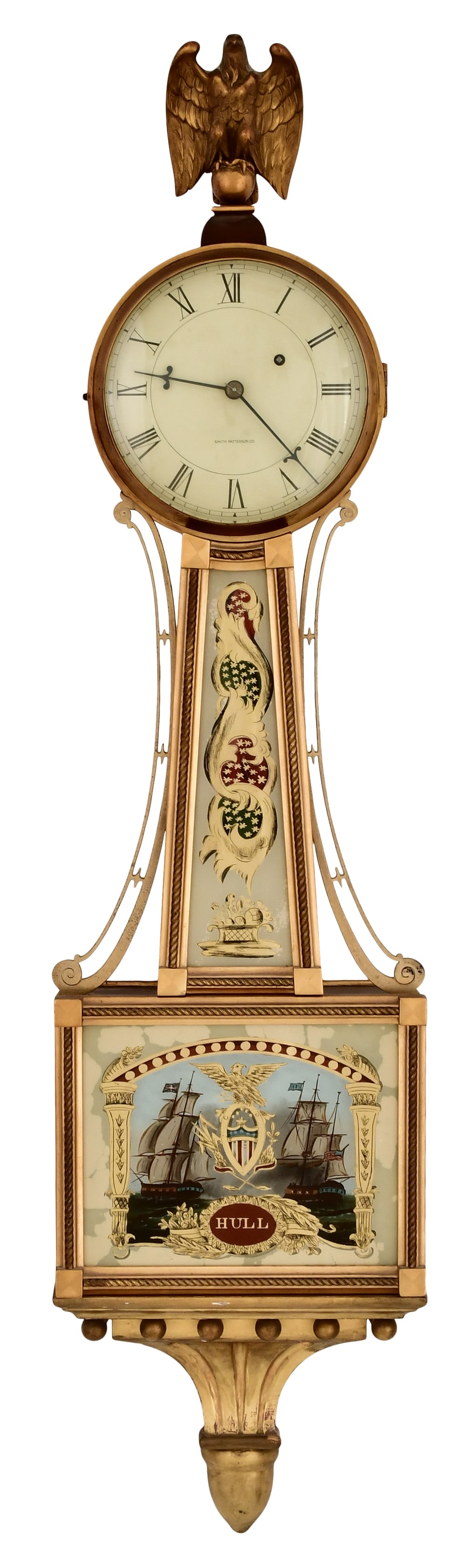 Smith Patterson Co. "Willard" Presentation Banjo Clock, "Constitution vs. Guerriere": Smith Patterson Co. "Willard" Presentation Banjo Clock, "Constitution vs. Guerriere"circa 1930mahogany case with gilded rope trim surrounding the door and throat glass, lower tablet depicts Constituti