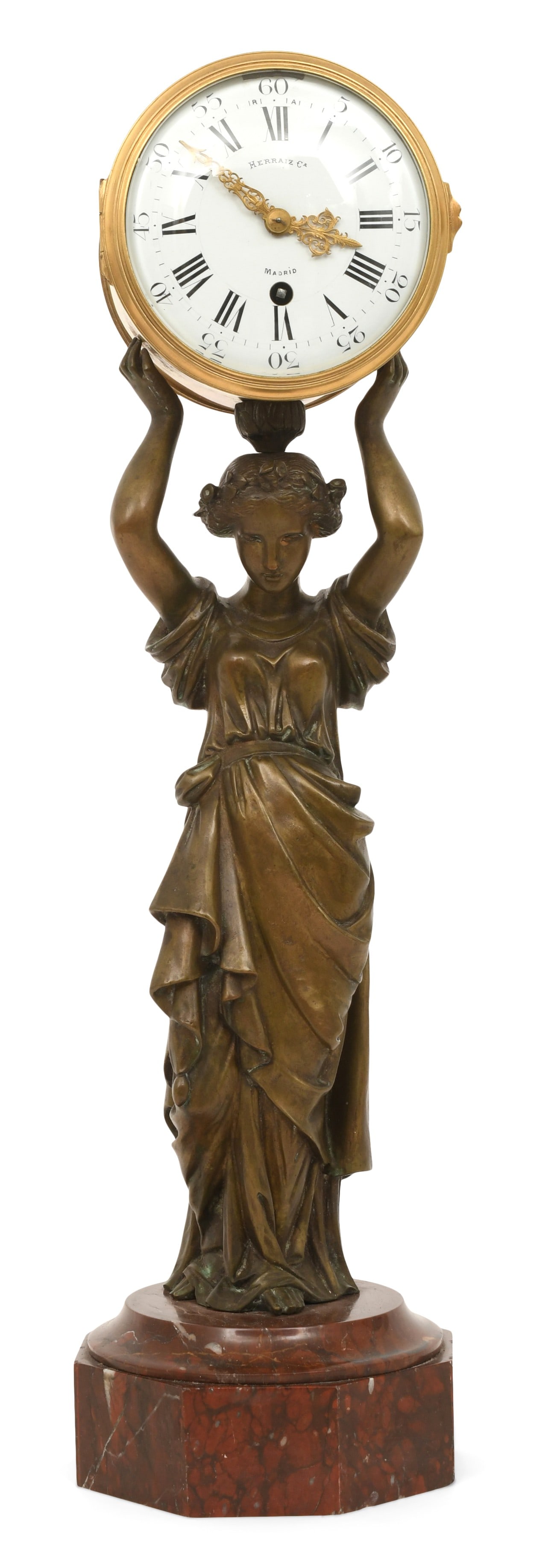 French Patinated Bronze & Rouge Marble Statue Clock: French Patinated Bronze & Rouge Marble Statue Clocklate 19th centurymodeled as a classical woman holding a clock above her head, supported by an octagonal rouge marble base, French brass ebache 8-day