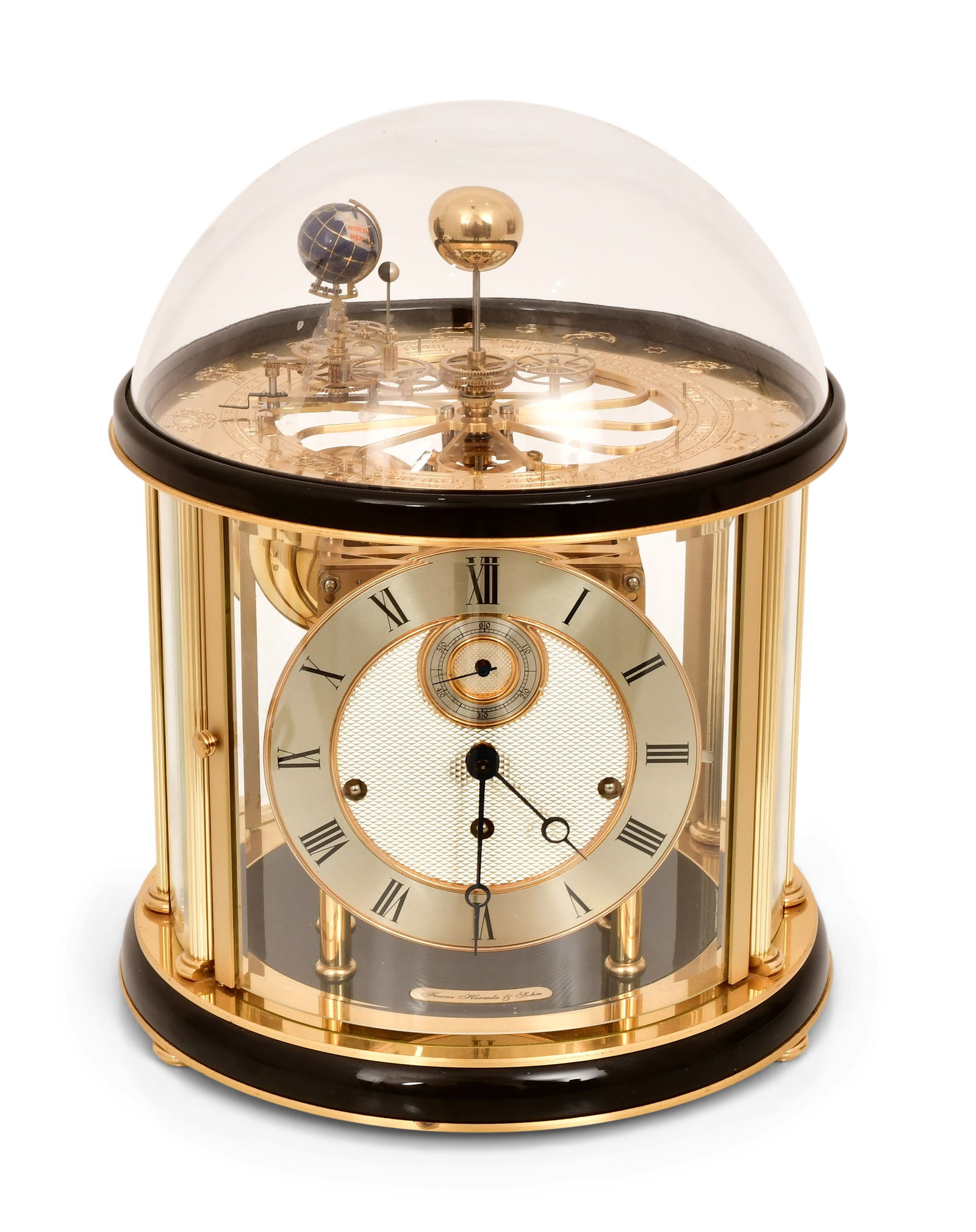 Hermle "Tellurium" Planetarium Desk Clock: Hermle "Tellurium" Planetarium Desk Clocklate 20th centuryenameled brass base with glass dome, 8-day brass spring driven Westminster chime movement powering a surmounted planetarium with the earth and