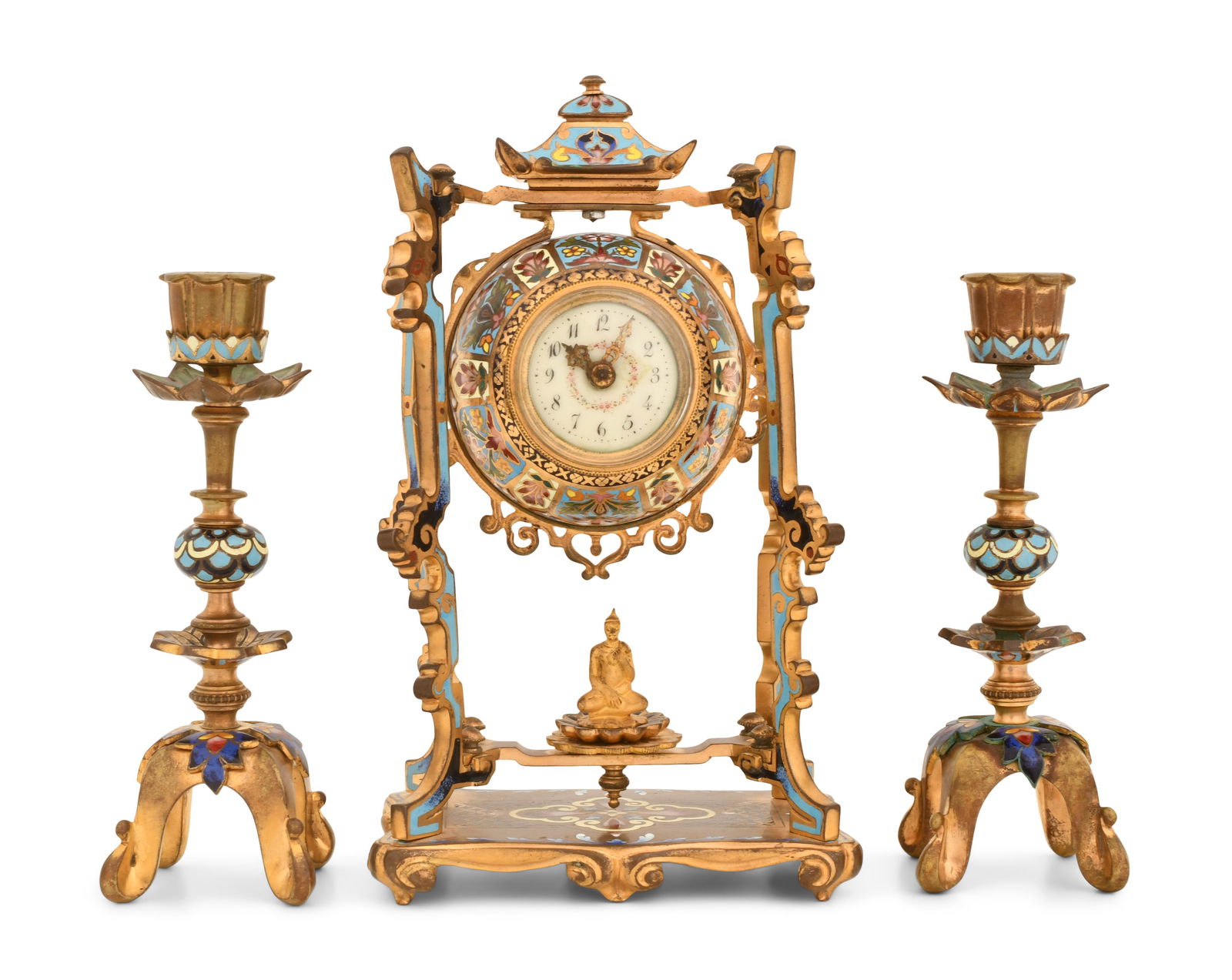 French Gilt Bronze & Champleve Clock Garniture: French Gilt Bronze & Champleve Clock Garniturelate 19th centuryAsian style portico clock with a seated Buddha and champleve decoration, candlesticks with matching decoration and curved feet, 8-day bra