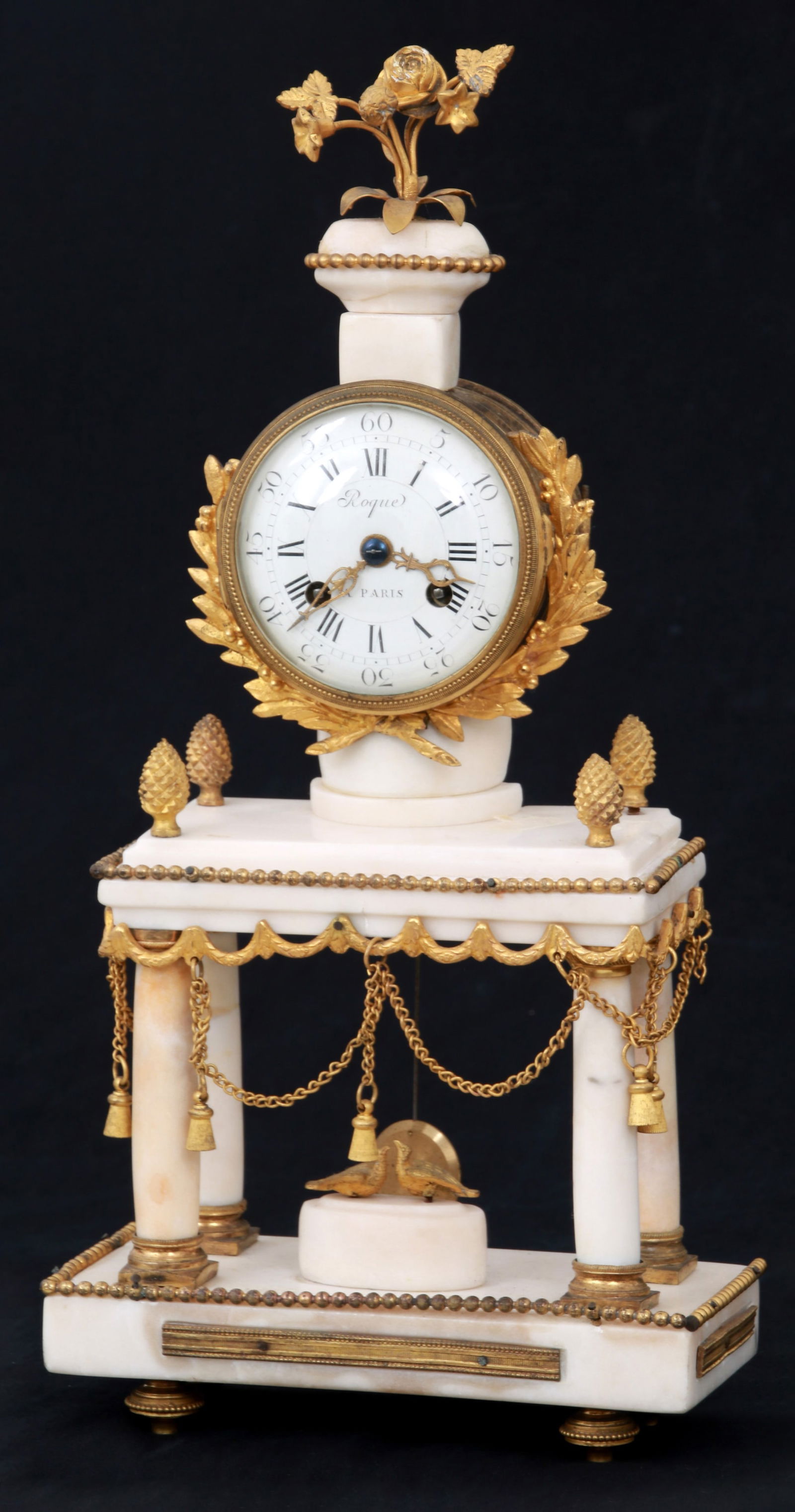French Bronze & Alabaster Mantel Clock: French Bronze & Alabaster Mantel Clocklate 19th centurywith a rectangular base on four gilt bronze feet, upper tier raised on four columns with gilt bronze capitals, pinecone finials, bronze trim with