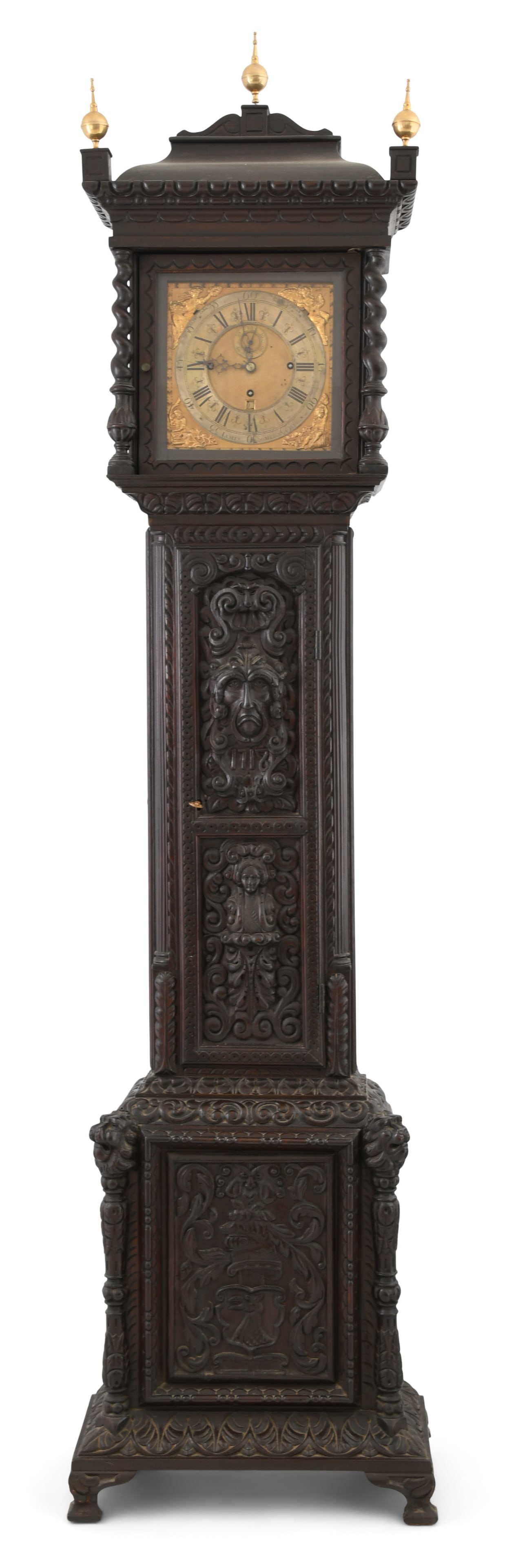 William & Mary Style Tall Case Clock: William & Mary Style Tall Case Clockearly 19th centurythe oak case with figural and scrolling carvings, brass 8-day weight driven movement with chimes on either 4 or 8 bells, the dial with sub-calenda