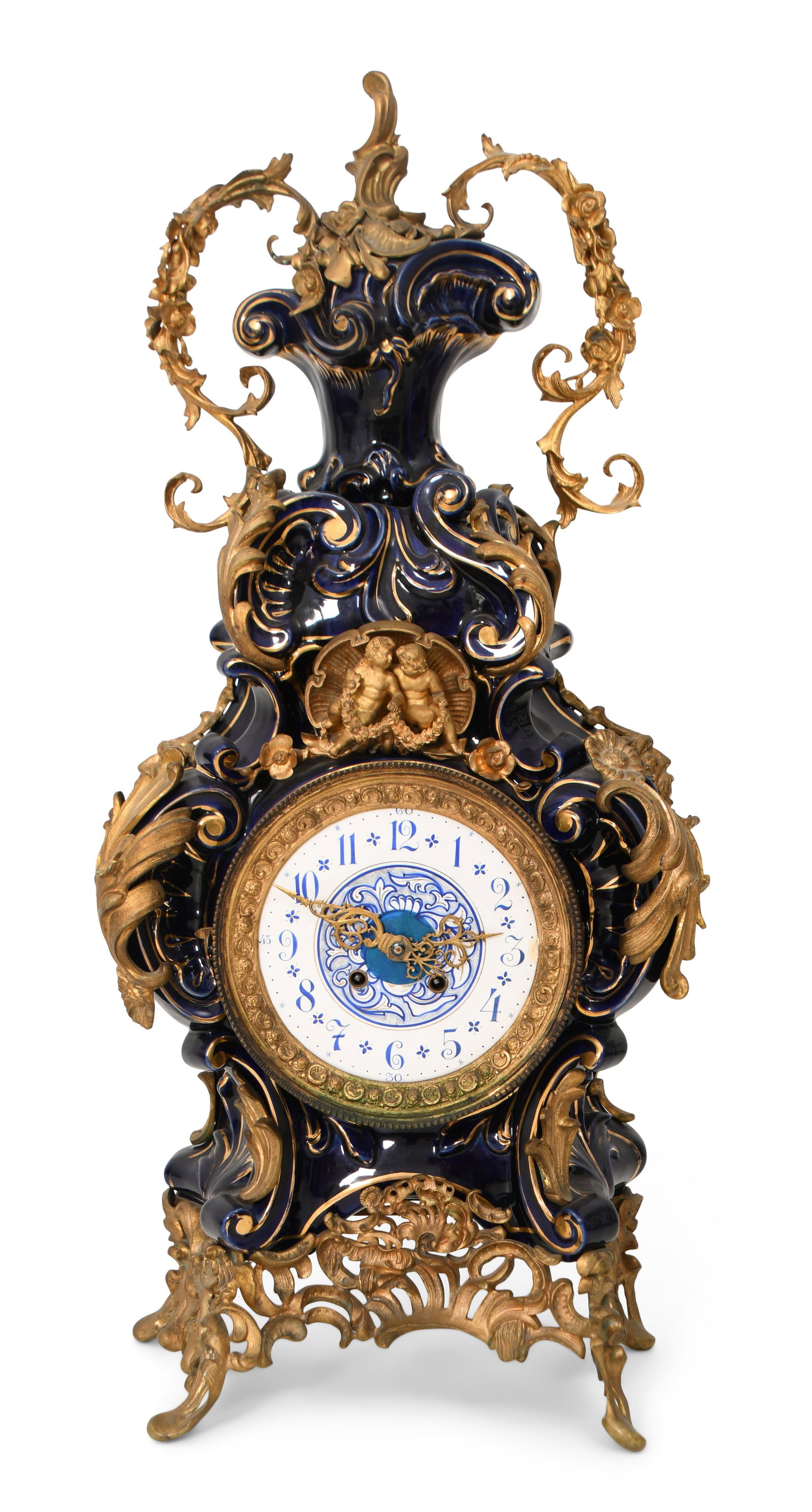 A Massive Gustav Becker Gilt Bronze-Mounted Porcelain Shelf Clock: A Massive Gustav Becker Gilt Bronze-Mounted Porcelain Shelf Clocklate 19th centurythe porcelain case with gilt bronze mounts of scrollwork and two putti in a shell, 8-day brass time and strike movemen
