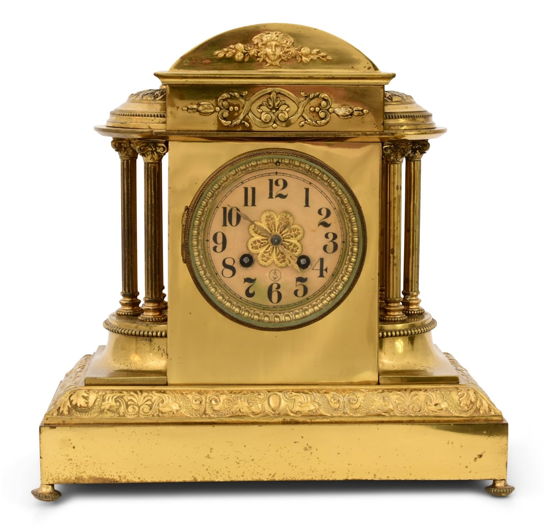 J.E. Caldwell & Co. Brass Mantel Clock: J.E. Caldwell & Co. Brass Mantel Clocklate 19th centurythe case with an arched top, maiden's head, filigree and three-column side clusters, round French brass 8 day spring driven movement with a half