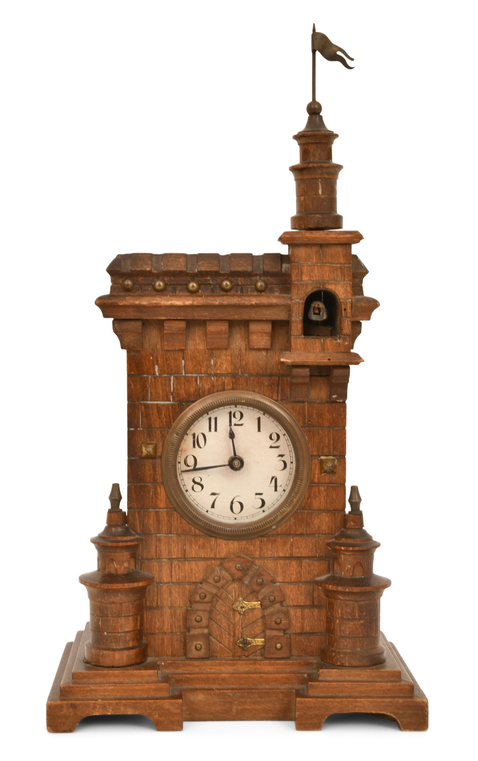 Black Forest Carved Castle-Form Cuckoo Clock: Black Forest Carved Castle-Form Cuckoo Clocklate 19th centurywalnut case in the form of a castle with a cuckoo bird in the window below the spire, 30-hour brass spring driven movement with pin lever e