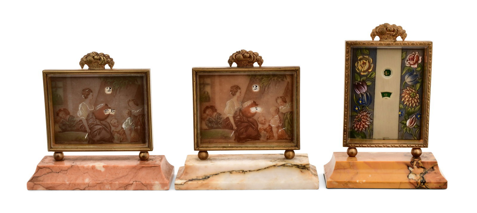 Three Swiss Jump Hour Desk Clocks: Three Swiss Jump Hour Desk Clocksearly 20th centurygilt brass frames with marble bases and digital jump hour dials, 8-day brass time only movements with lever escapement, signed on the reverse4 1/2 x