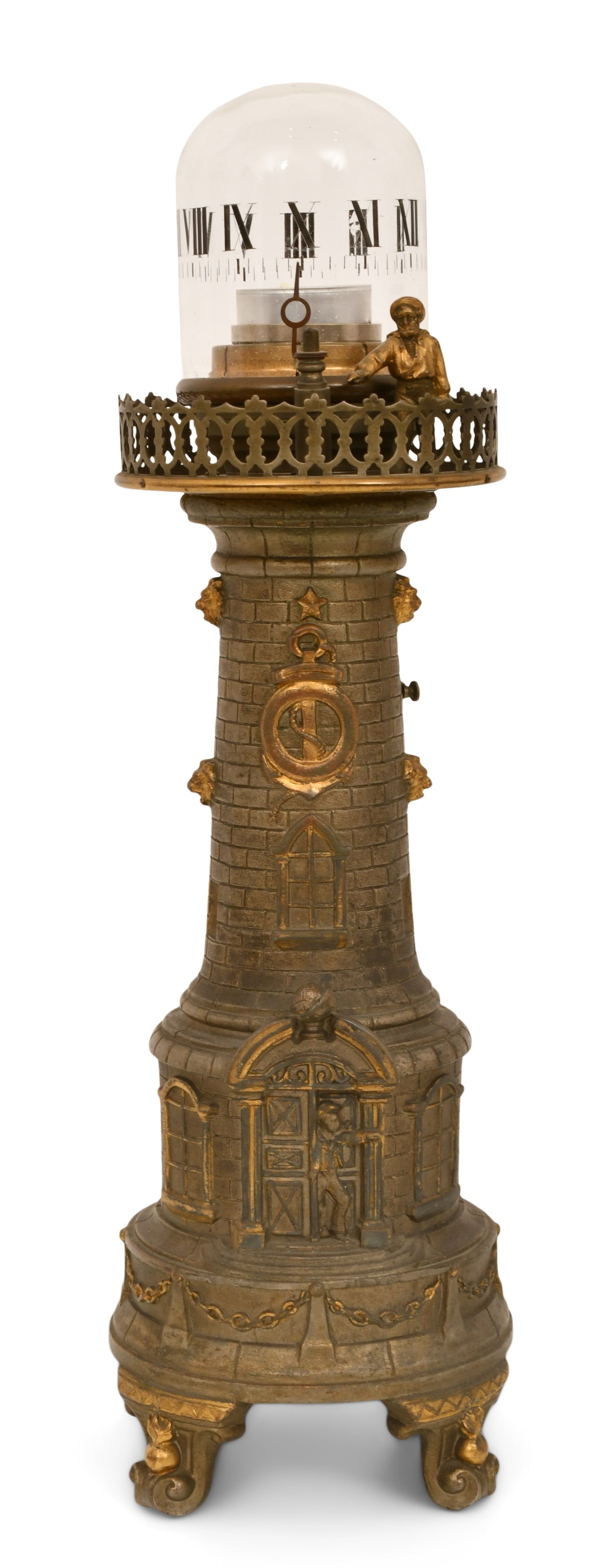 Annular Lighthouse Clock: Annular Lighthouse Clocklate 20th centurypatinated brass lighthouse with a surmounted glass dome having roman numerals and a figure pointing to the time, a candle illuminates the dome, 30-hour brass s