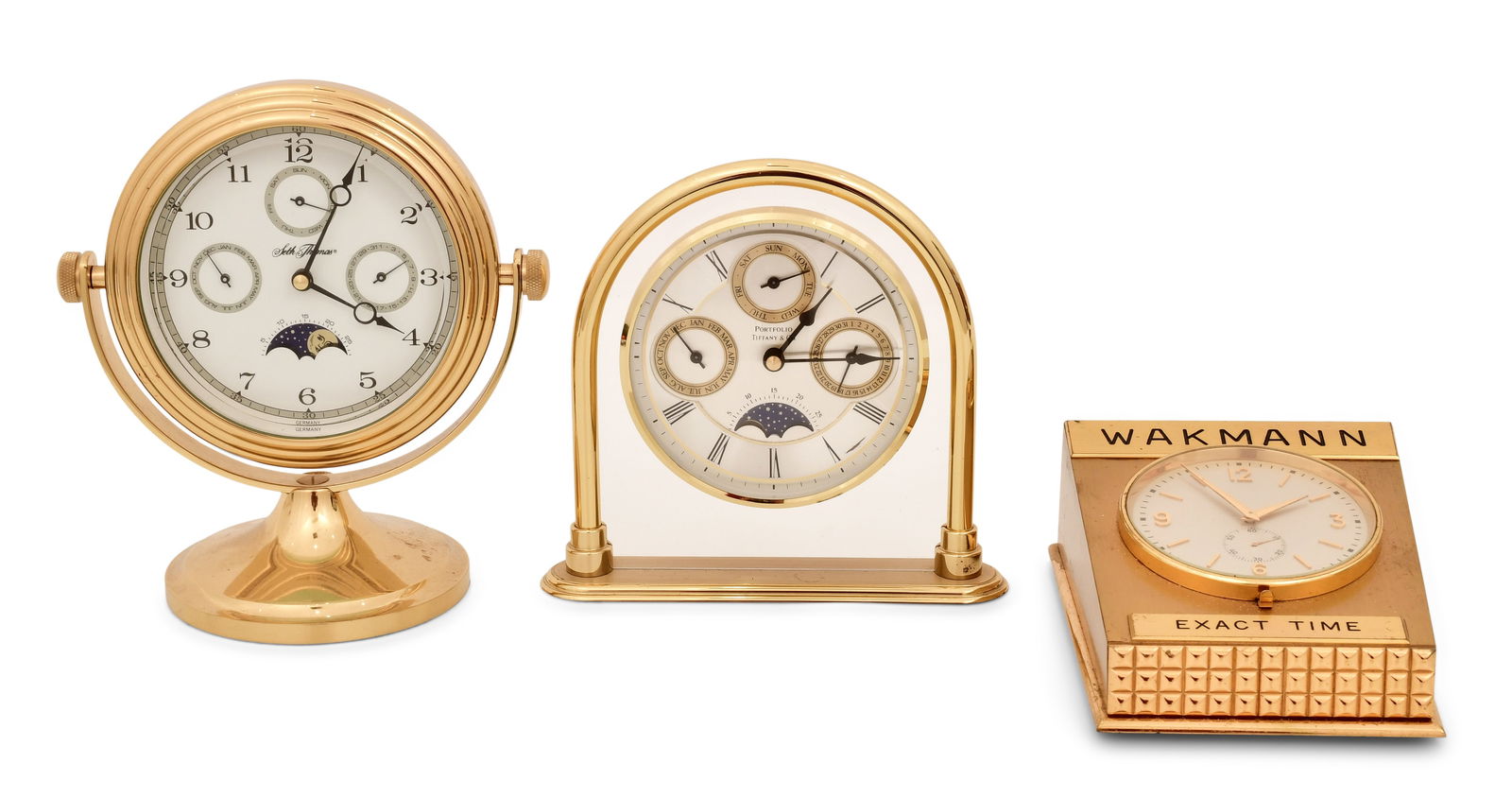 Three Desk Clocks, Tiffany & Co., Wakmann and Seth Thomas: Three Desk Clocks, Tiffany & Co., Wakmann and Seth Thomaslate 20th century1. Seth Thomas desk clock with calendar and moon phase, quartz movement, functions properly.2. Tiffany & Co. "Portfollio" desk