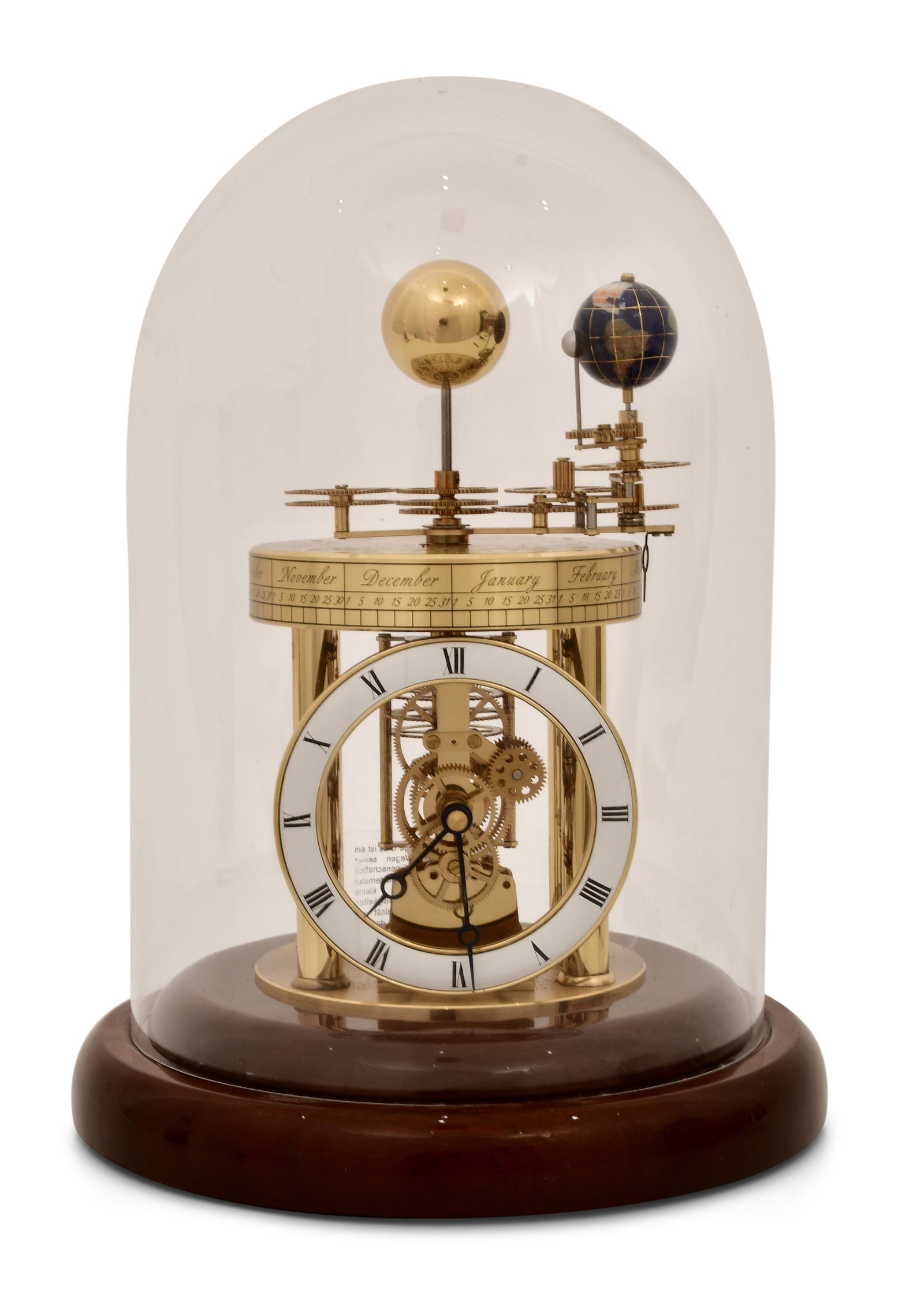Hermle "Astrolabium" Planetarium Desk Clock: Hermle "Astrolabium" Planetarium Desk Clocklate 20th centurymahogany base with glass dome, battery operated quartz movement powering a surmounted planetarium with the earth and moon rotating around th