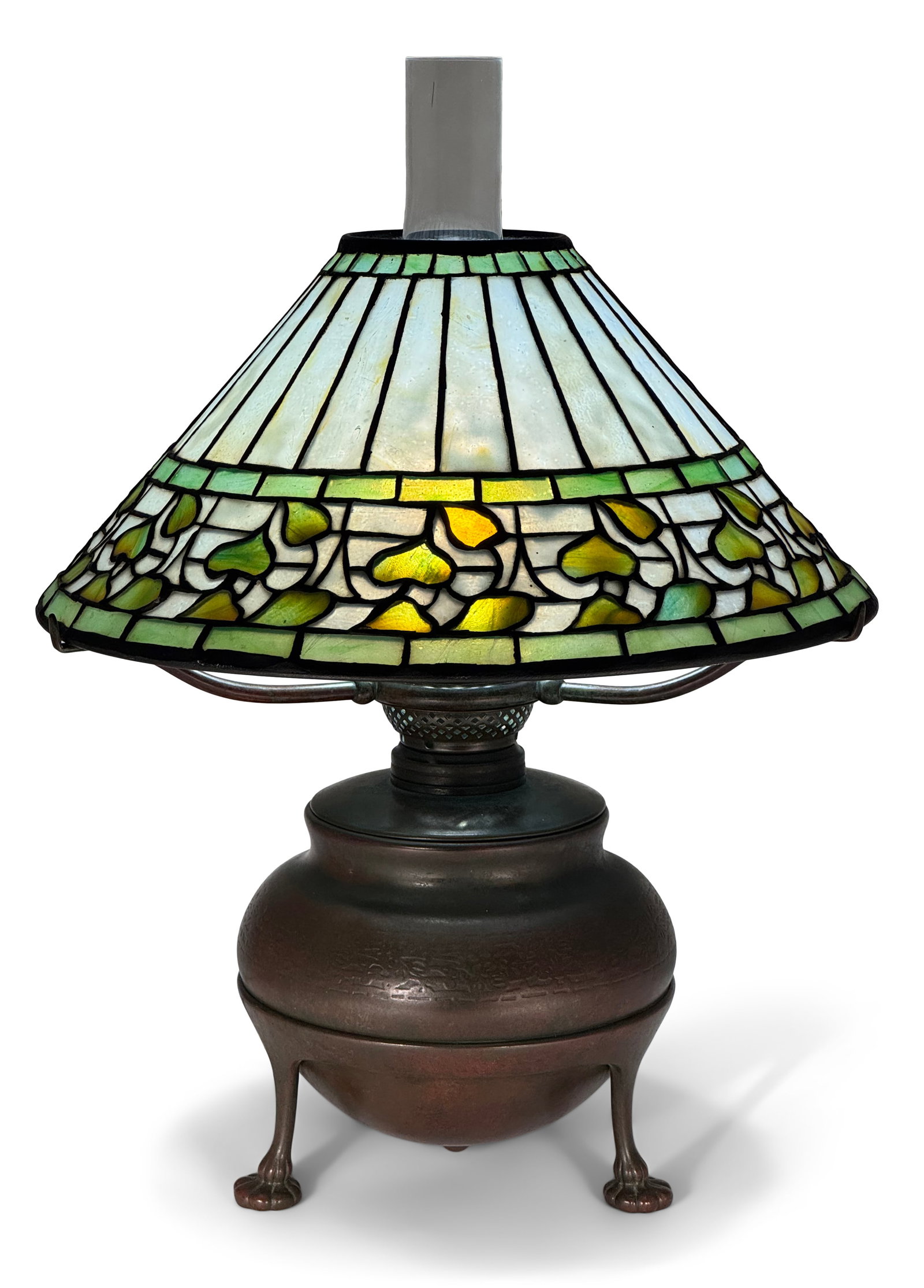 Tiffany Studios, An Early "Vine Border" Table Lamp: Tiffany Studios An Early "Vine Border" Table Lamp circa 1900 leaded glass, patinated bronze shade impressed "Tiffany Studios, New York" oil canister impressed "Tiffany Studios, New York" and with the