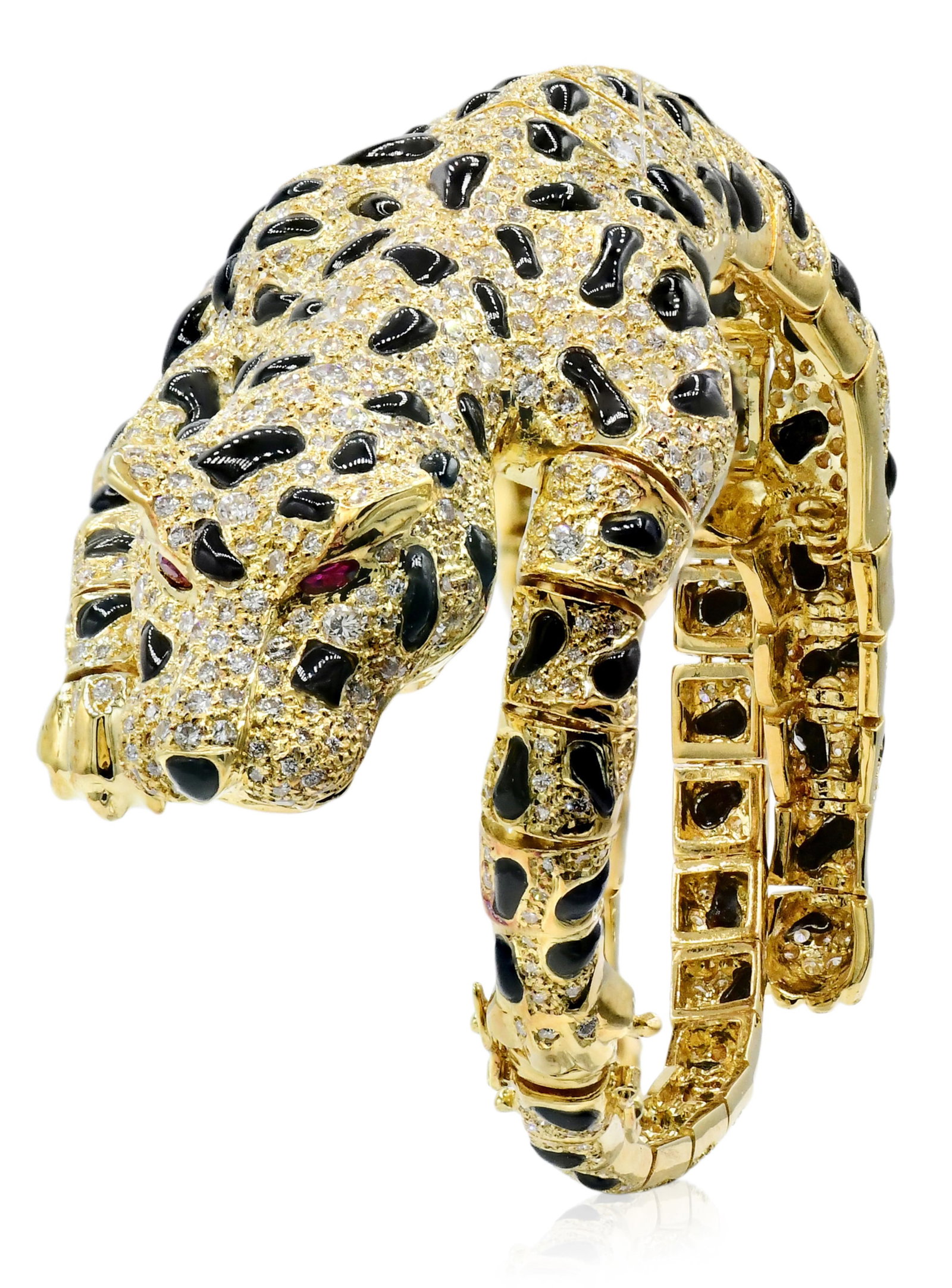 18K Yellow Gold, Diamond, Black Onyx & Ruby Leopard Bracelet/Brooch: 18K Yellow Gold, Diamond, Black Onyx & Ruby Leopard Bracelet/Brooch • set with round brilliant diamonds weighing a total of 5.89 carats • the eyes set with faceted oval rubies weighing a t