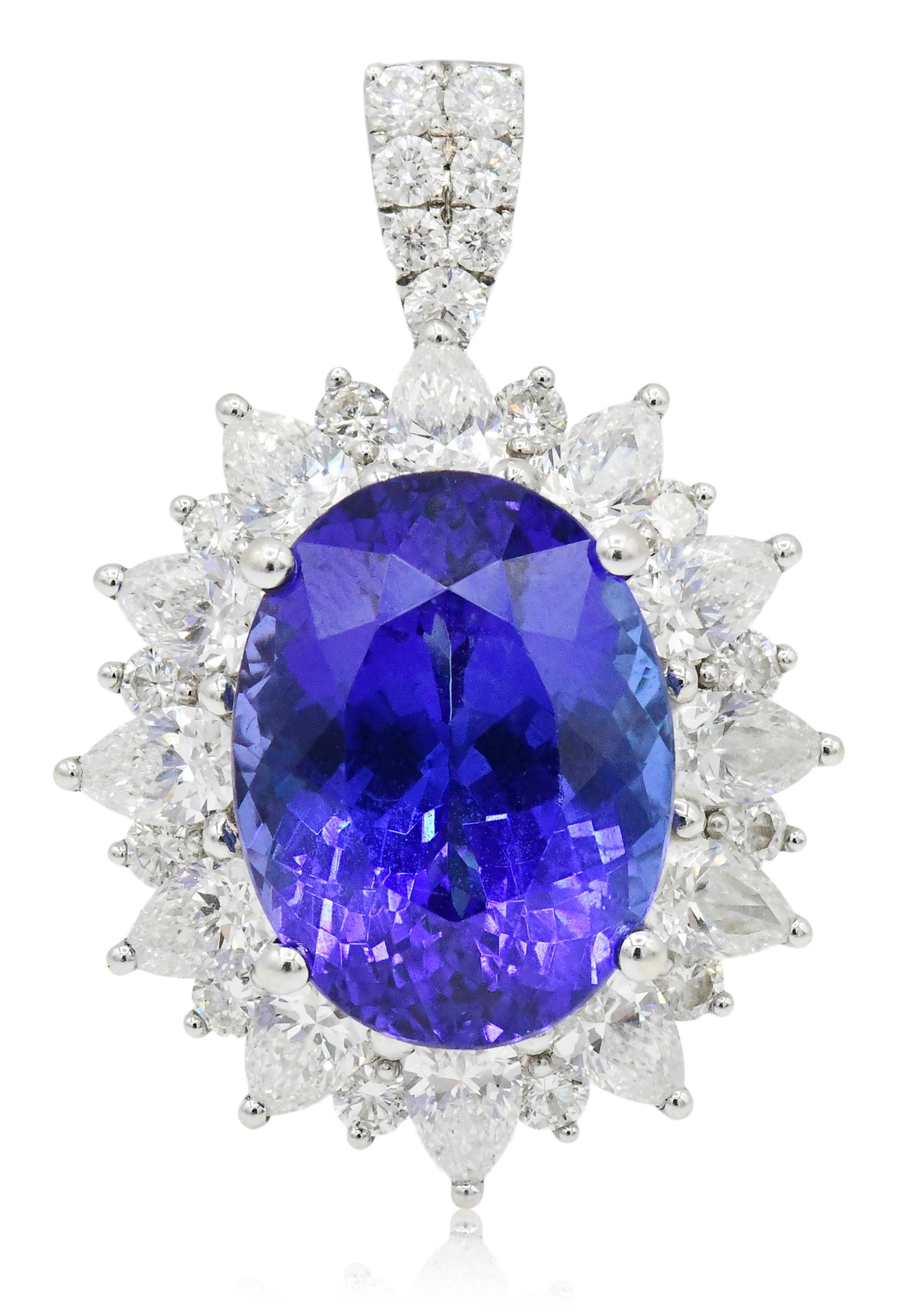 18K White Gold, 12.74 Carat Tanzanite & Diamond Ring/Pendant: 18K White Gold, 12.74 Carat Tanzanite & Diamond Ring/Pendant • featuring a 12.74 carat brilliant cut oval tanzanite with eye clean clarity, medium dark/strong bluish violet color and very good c